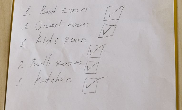 A checklist on a clipboard, relevant to reading a school's new Ofsted report card