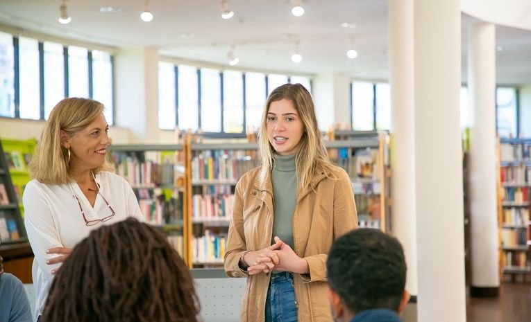 A student discussing with a teacher, relevant to preparing for a university interview